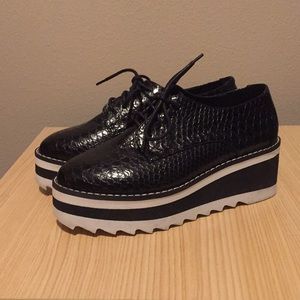 Black snakeskin platform shoes